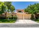 Charming home featuring a terra cotta tile roof, an attached two-car garage and well-manicured front lawn at 5133 Southern Hills Ln, Las Vegas, NV 89113