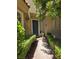 Inviting front entrance with a charming blue door and manicured landscaping at 5133 Southern Hills Ln, Las Vegas, NV 89113