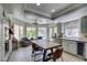Eat-in kitchen featuring custom cabinets, stainless steel appliances, granite counters and views to the backyard at 5133 Southern Hills Ln, Las Vegas, NV 89113