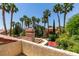Stunning backyard landscape with palm trees, lush greenery, and mature trees offering lots of privacy at 5133 Southern Hills Ln, Las Vegas, NV 89113