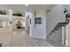 Spacious living room with durable floors, a modern fireplace, and stairs leading to the second level at 5133 Southern Hills Ln, Las Vegas, NV 89113