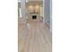 Open living room featuring a fireplace, neutral tones, and hardwood floors at 5133 Southern Hills Ln, Las Vegas, NV 89113