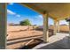 Covered patio overlooking a large, blank canvas backyard ready for landscaping at 5907 Soft Mist Ct, Las Vegas, NV 89110