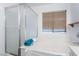 Bathtub with shower and window in a bright bathroom at 5907 Soft Mist Ct, Las Vegas, NV 89110