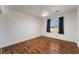Bedroom with ceiling fan and laminate floors at 5907 Soft Mist Ct, Las Vegas, NV 89110