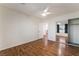 Bright bedroom features a ceiling fan, closet with mirrored doors, and wood-look flooring at 5907 Soft Mist Ct, Las Vegas, NV 89110
