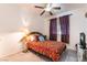 Bedroom with decorative headboard, ceiling fan and gray vinyl floors at 5907 Soft Mist Ct, Las Vegas, NV 89110