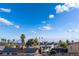 Las Vegas skyline view from rooftop with solar panels on nearby homes at 5907 Soft Mist Ct, Las Vegas, NV 89110