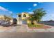 Charming two-story home featuring a two-car garage, manicured lawn, and beautiful landscaping at 5907 Soft Mist Ct, Las Vegas, NV 89110