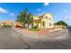 Two-story home featuring a two-car garage, manicured lawn, and rock landscaping at 5907 Soft Mist Ct, Las Vegas, NV 89110