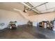 Spacious garage featuring concrete floors, overhead storage and lots of room at 5907 Soft Mist Ct, Las Vegas, NV 89110