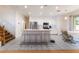 Bright, open kitchen featuring stainless appliances and an island with bar stool seating at 5907 Soft Mist Ct, Las Vegas, NV 89110