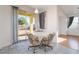 Breakfast nook with sliding glass door, table, chairs, and lots of natural light at 5907 Soft Mist Ct, Las Vegas, NV 89110