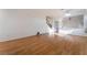 Bright living room with wood floors, neutral walls, and staircase leading to second story at 5907 Soft Mist Ct, Las Vegas, NV 89110