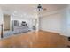 Open living room flows into the kitchen and features wood floors, and neutral walls at 5907 Soft Mist Ct, Las Vegas, NV 89110