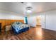 Spacious bedroom features wood floors, adjacent bathroom, and ample natural light at 5907 Soft Mist Ct, Las Vegas, NV 89110