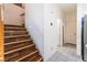 Staircase with wood steps and railings, leading to the upper level of the home at 5907 Soft Mist Ct, Las Vegas, NV 89110