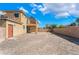 Large backyard featuring neutral colored stucco walls and covered patio area, perfect for outdoor living at 5938 Village Loft St, North Las Vegas, NV 89081