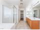 Bathroom with tile flooring, glass enclosed shower, and double vanity at 5938 Village Loft St, North Las Vegas, NV 89081