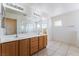 Bathroom with double vanity and tiled floor at 5938 Village Loft St, North Las Vegas, NV 89081