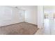 A bright bedroom with two windows and neutral carpet at 5938 Village Loft St, North Las Vegas, NV 89081