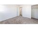 Spacious bedroom boasts neutral carpet, closet and access to additional rooms at 5938 Village Loft St, North Las Vegas, NV 89081