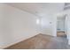 Bright bedroom features neutral carpet and white walls at 5938 Village Loft St, North Las Vegas, NV 89081