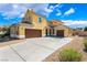 Stunning two-story home with a well-manicured yard and a spacious three car driveway at 5938 Village Loft St, North Las Vegas, NV 89081