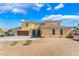 Beautiful house with rock landscaping, a two car garage, and large driveway at 5938 Village Loft St, North Las Vegas, NV 89081