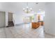 Open-concept living room with an island and chandelier lighting at 5938 Village Loft St, North Las Vegas, NV 89081
