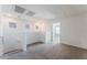 Loft area on upper level with neutral colored carpeting and white walls at 5938 Village Loft St, North Las Vegas, NV 89081