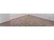 Empty room with neutral carpeting and white walls at 5938 Village Loft St, North Las Vegas, NV 89081