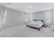 Spacious bedroom with neutral tones, plush carpeting, and bright natural light from large window at 6429 Joshuaville Dr, Las Vegas, NV 89122