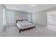 Bright bedroom featuring plush carpeting, and neutral paint; bathroom access creates an en-suite experience at 6429 Joshuaville Dr, Las Vegas, NV 89122