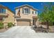 Two-story home featuring a two car garage, neutral color palette, and desert landscaping at 6429 Joshuaville Dr, Las Vegas, NV 89122
