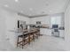 Bright eat-in kitchen featuring a large island, modern appliances, and a built-in desk at 6429 Joshuaville Dr, Las Vegas, NV 89122