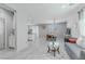 Open-concept living room features tile floors, ceiling fan, and natural light at 6429 Joshuaville Dr, Las Vegas, NV 89122