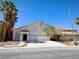 An inviting two-story home with a symmetrical facade and an attached two-car garage at 6608 Buried Treasure Ct, Las Vegas, NV 89139