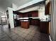 Well-equipped kitchen with stainless steel appliances, granite countertops, and center island at 6608 Buried Treasure Ct, Las Vegas, NV 89139