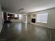 Living room features hardwood floors, large windows, and a fireplace at 6608 Buried Treasure Ct, Las Vegas, NV 89139