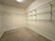 A walk-in closet with shelving for storage and organization at 6608 Buried Treasure Ct, Las Vegas, NV 89139