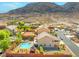 Spacious backyard with pool, gazebo, and lush landscaping, perfect for outdoor entertaining and relaxation at 6958 Lazy Sunset Ct, Las Vegas, NV 89156