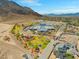 Panoramic aerial view featuring school, playground, and recreational area with picturesque mountain backdrop at 6958 Lazy Sunset Ct, Las Vegas, NV 89156