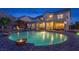 Gorgeous backyard featuring a large in-ground pool, a hot tub, and a spacious patio area at 6958 Lazy Sunset Ct, Las Vegas, NV 89156