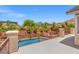 Upper balcony with views of the pool and lush green landscape at 6958 Lazy Sunset Ct, Las Vegas, NV 89156