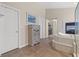 Spacious bathroom featuring a soaking tub with fireplace and glass enclosed shower at 6958 Lazy Sunset Ct, Las Vegas, NV 89156