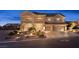 Beautiful two-story home with a well-manicured front yard and a spacious two-car garage at 6958 Lazy Sunset Ct, Las Vegas, NV 89156