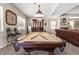 Game room features a pool table, elegant furnishings, and a cozy atmosphere at 6958 Lazy Sunset Ct, Las Vegas, NV 89156