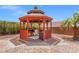 Outdoor gazebo featuring a grill, mini fridge, and patio furniture at 6958 Lazy Sunset Ct, Las Vegas, NV 89156