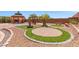 Backyard gazebo with a fountain and beautiful garden at 6958 Lazy Sunset Ct, Las Vegas, NV 89156
